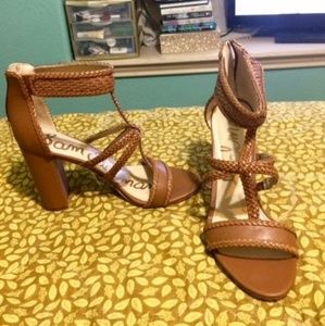 Braided leather sandals with chunky heel.